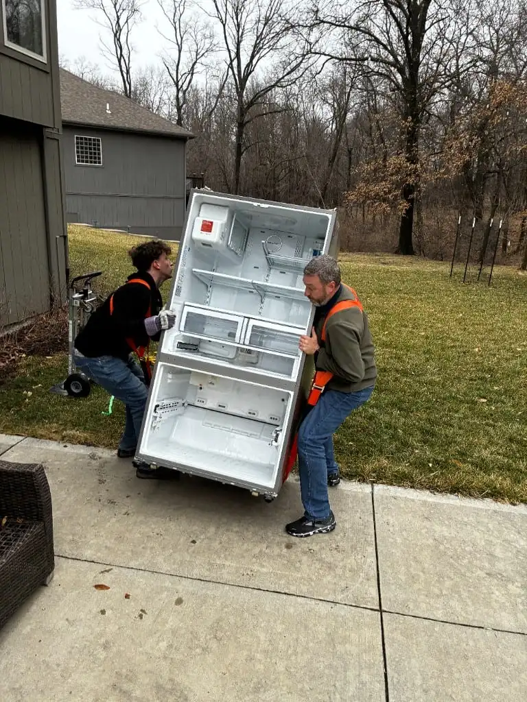 Crew removing a refrigerator from a home in Platte County